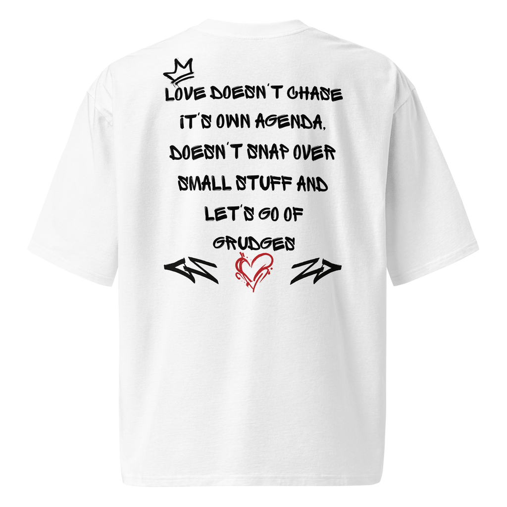 White oversized street tee with graffiti-style lettering on the back, and raw, hand-tagged "Love is in the Air" artwork on the front. A bold statement in urban fashion.