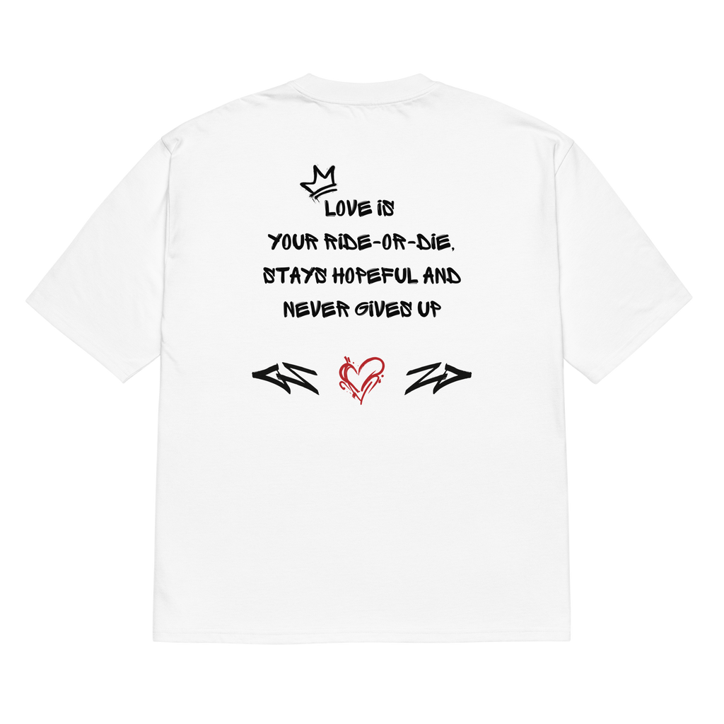 White oversized t-shirt with bold graffiti-style artwork featuring "Love is in the Air" tagging. A raw, urban design celebrating loyalty, love, and commitment.