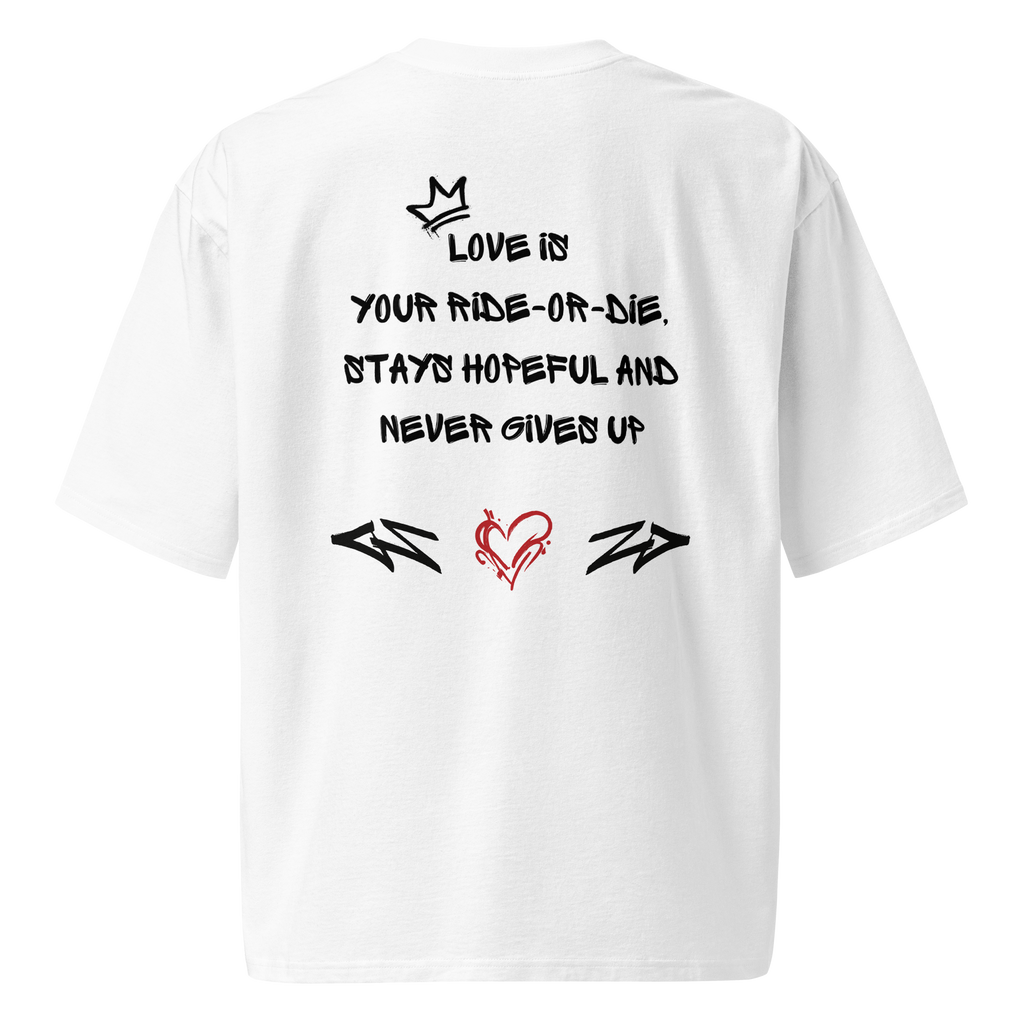 White oversized t-shirt with bold graffiti-style artwork featuring "Love is in the Air" tagging. A raw, urban design celebrating loyalty, love, and commitment.