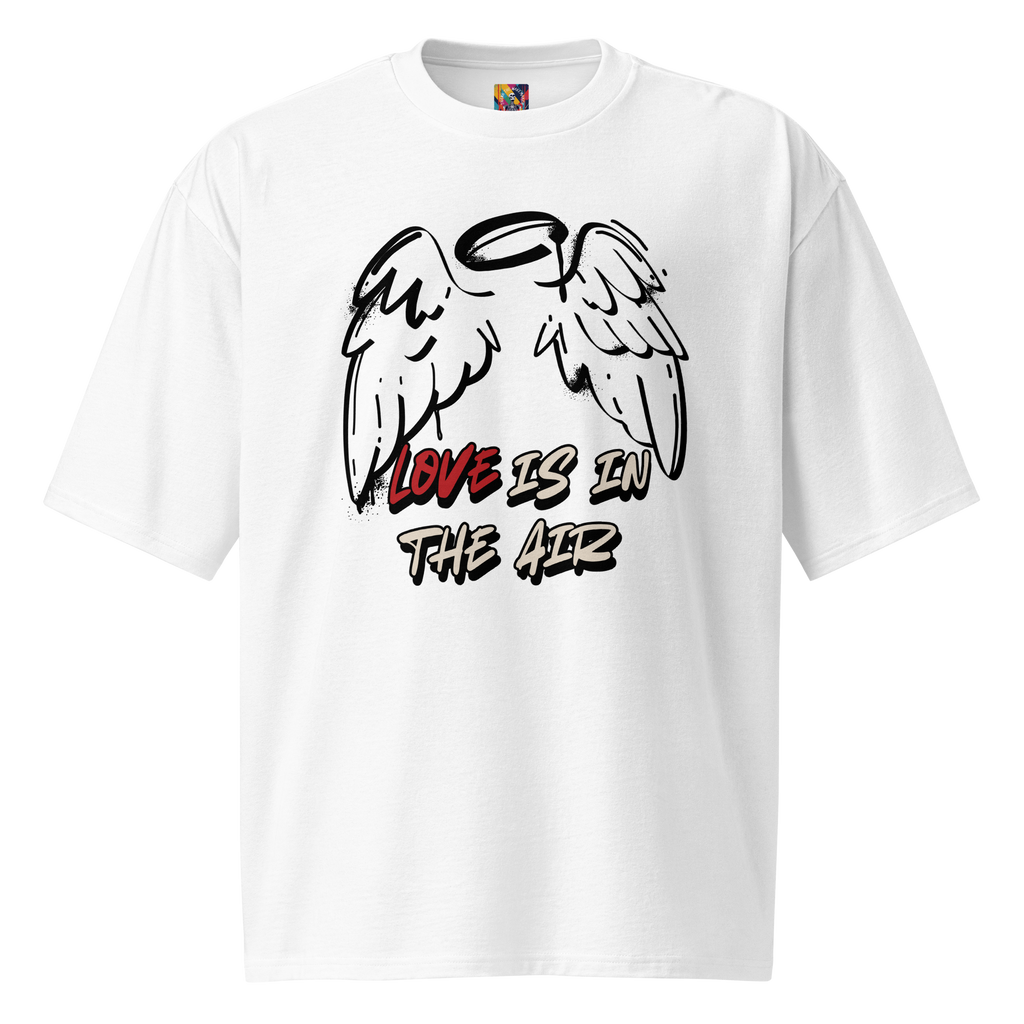 Oversized white streetwear t-shirt with bold graffiti lettering on the back and a raw, hand-tagged "Love is in the Air" design on the front. Urban, artistic, and built for everyday wear.