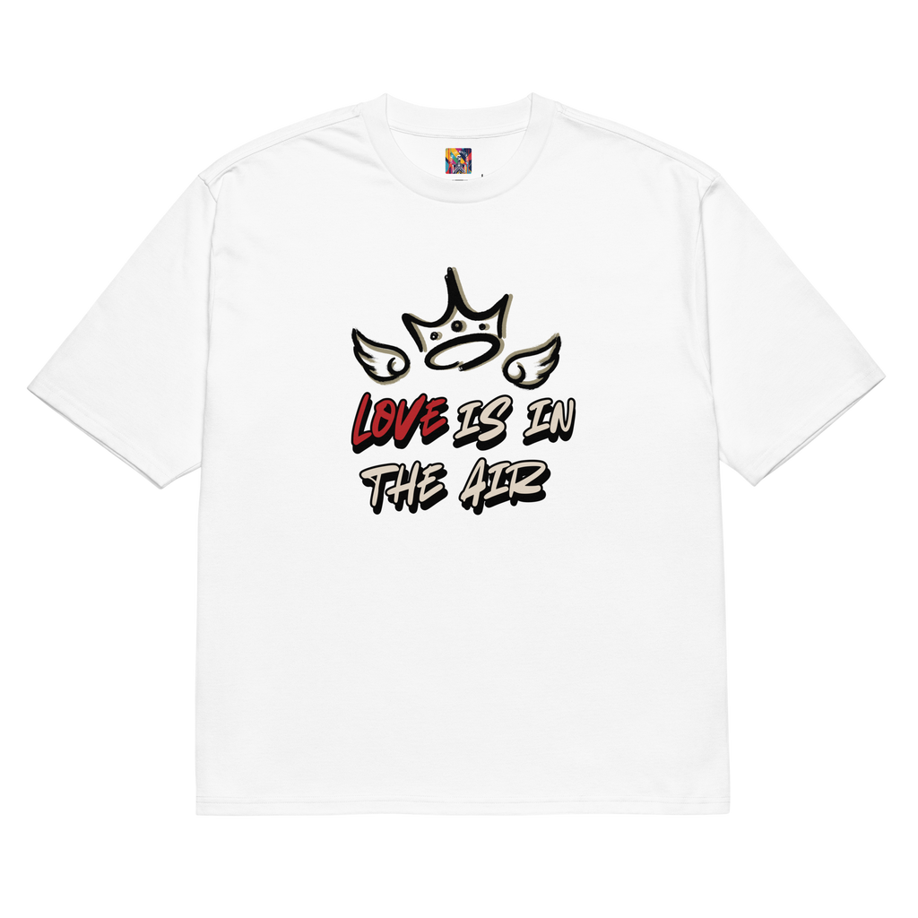 White oversized street tee with graffiti-style lettering on the back, and raw, hand-tagged "Love is in the Air" artwork on the front. A bold statement in urban fashion.