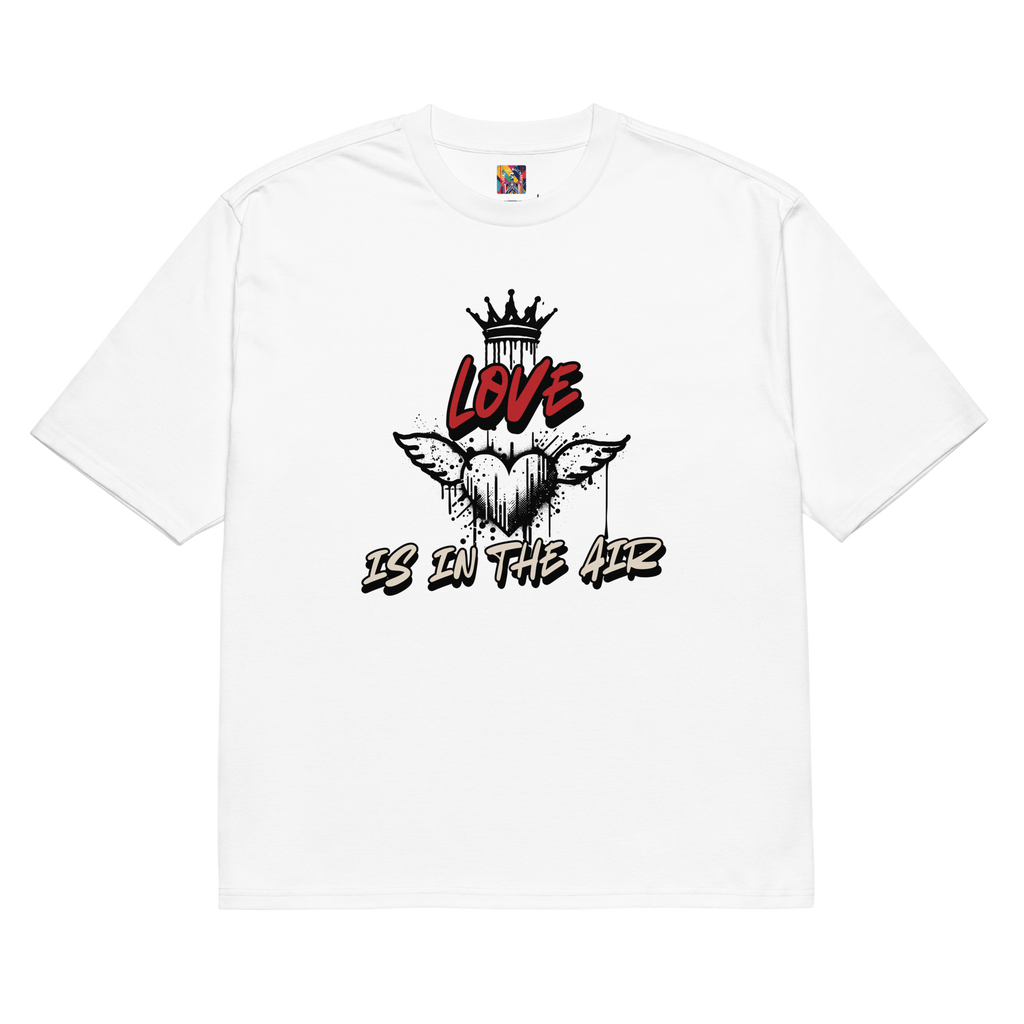 White oversized t-shirt with bold graffiti-style artwork featuring "Love is in the Air" tagging. A raw, urban design celebrating loyalty, love, and commitment.