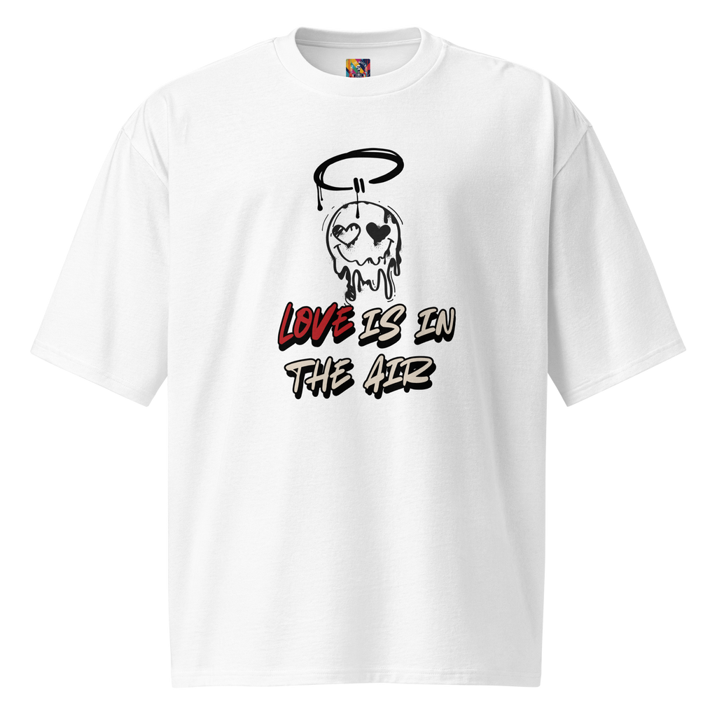 White oversized t-shirt featuring bold graffiti lettering on the back, and raw, street-style "Love is in the Air" tagging on the front. A statement in patience and real love.