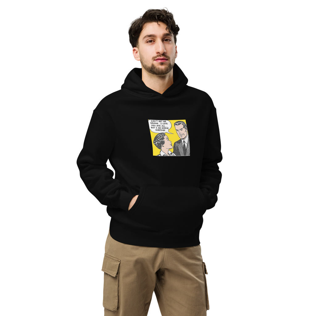 "Don't Get Me Wrong...I Love You And All, But I'm Going Surfing" Black Hoodie

Pull on this oversized hoodie and let the world know where your priorities lie—surf’s up, always. Featuring a throwback comic strip graphic on the front and the iconic THANK THE WAVEMAKER logo running down the left sleeve, this piece brings effortless style with a bold attitude.

Perfect for layering, cruising the streets, or kicking back after a sesh, the relaxed fit and extra soft fleece keep you cozy while staying true to your